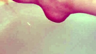 naked couple playing in the bathtub