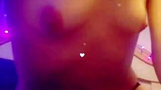 She smokes while stripping seductively.