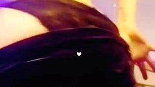 She smokes while stripping seductively.