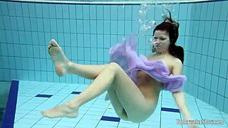 Aneta Showcases Big Tits In Purple Dress While Bathing In Pool