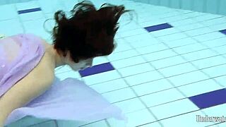 Aneta Showcases Big Tits In Purple Dress While Bathing In Pool