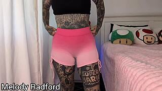 big tits milf tries on gym leggings in bedroom