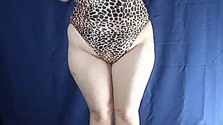 Uncensored try-on of one-piece swimsuit highlighting big tits and ass