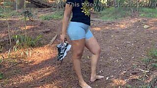 Does she get naked in the woods with big ass?