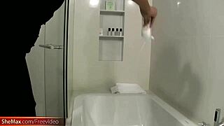 Adorable ladyboy strips in shower and strokes cock for you