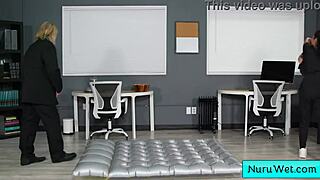 Ebony masseuse gives wet Nuru massage with big natural tits.