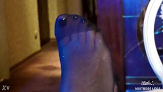 Damn, this sexy goddess in black rose pantyhose teases with her feet on heels! 😍