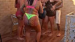 milf rabuda sitting on tattooed guy's dick, her curvy body pierced and mature