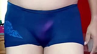 Femboy dances seductively in lingerie and panties, showing off ladyboy curves