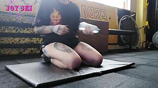 I'm the alternative girl streching at the gym, all tatooed