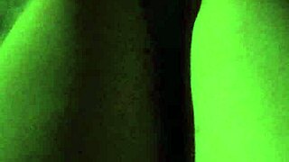 Gretala casually flashes her pregnant wife figure in the dark setting.