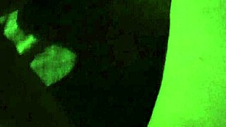 Gretala casually flashes her pregnant wife figure in the dark setting.