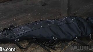 The narrative unfolds as a restrained girl faces punishment in the garage.