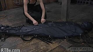 The narrative unfolds as a restrained girl faces punishment in the garage.