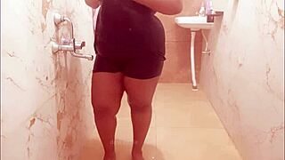 Myanmar milf slips into the shower, her curves glistening under the water in a steamy display