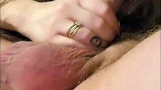 Brunette wife with glasses gives homemade blowjob to hubby, sucking his big white cock while moaning