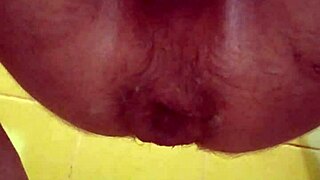 Male squirts intensely with two sandals stretching his ass