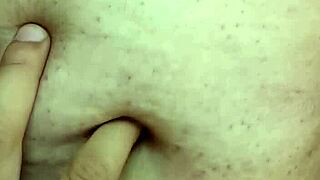 Detailed exploration of a milf's navel during massage