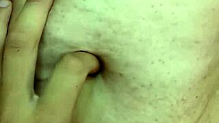 Detailed exploration of a milf's navel during massage