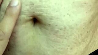 Detailed exploration of a milf's navel during massage