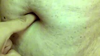 Detailed exploration of a milf's navel during massage