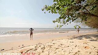 a caribbean girl strips naked on the beach, showers, and lets a stranger grope her ass