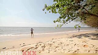 a caribbean girl strips naked on the beach, showers, and lets a stranger grope her ass