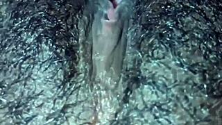 ebony woman plays with her wet hairy pussy solo