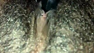 ebony woman plays with her wet hairy pussy solo
