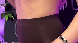 in the nylon club, a sexy mature blonde slowly puts on her coffee colored tights, teasing with her curves