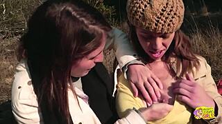 brunette friends turn picnic into strapon lesbian sex
