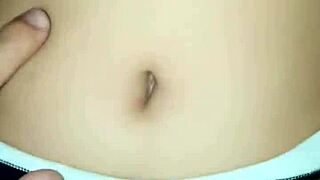 I peck her belly button while she rides me