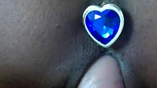 playing with my black dildo on the bed