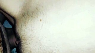 The mature woman stretches gracefully in a close-up view.