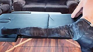 Stretching in compression pants on massage table HD