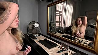 Sexy Tattooed Blonde Girl Doing Her Hair and Makeup Naked