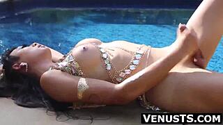 Venus Lux pleasures her big cock at the private pool