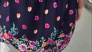 Following a mature woman in a skirt and thong on the street