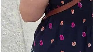 Following a mature woman in a skirt and thong on the street