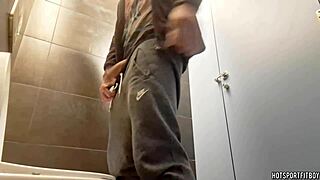amateur muscular bodybuilder engages in risky activity in a public bathroom. involves outdoor exposure.