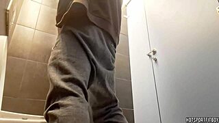amateur muscular bodybuilder engages in risky activity in a public bathroom. involves outdoor exposure.
