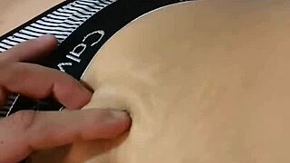 Amateur explores her deep navel with sensual massage