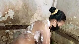 Housewife bathing while masturbating in the bathroom, fingering her hairy pussy