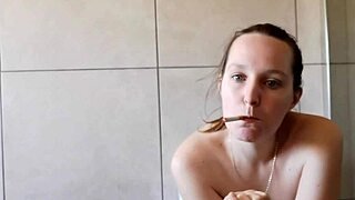 Cute girl smoking in the bathroom, looking so alluring!