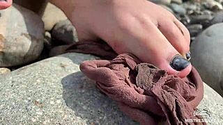 goddess teases messy torn pantyhose feet closeup by riverbank outdoors
