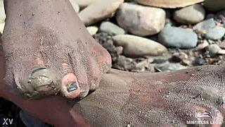 goddess teases messy torn pantyhose feet closeup by riverbank outdoors