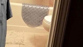 shy girl takes a steamy shower while bathing slowly in the tub.